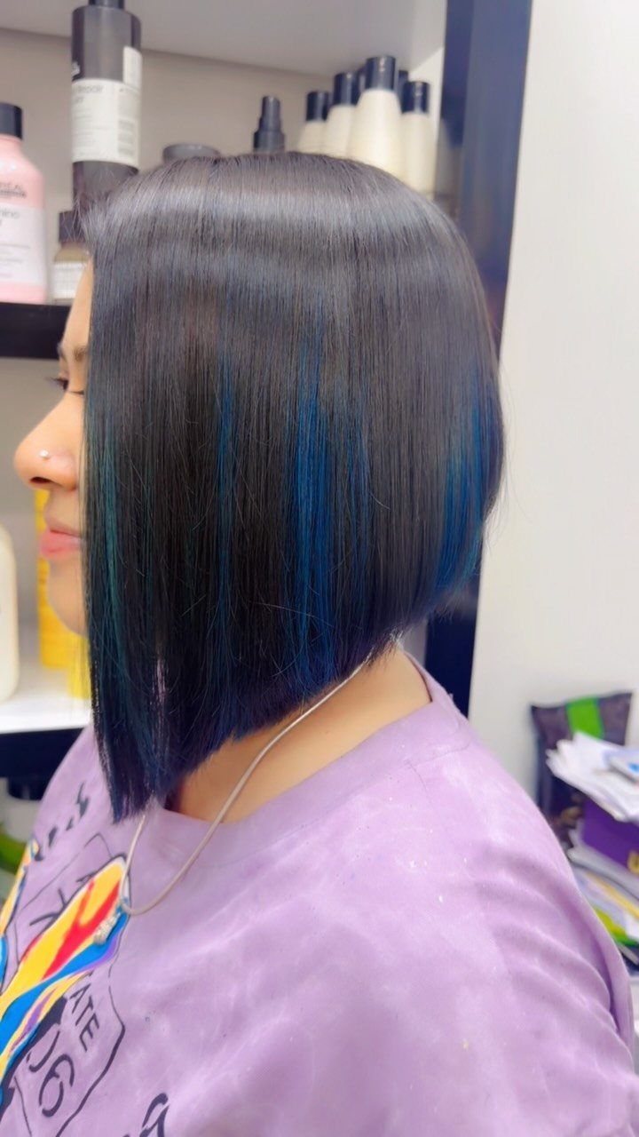 Straight dark bob with vivid blue streaks and longer front sections