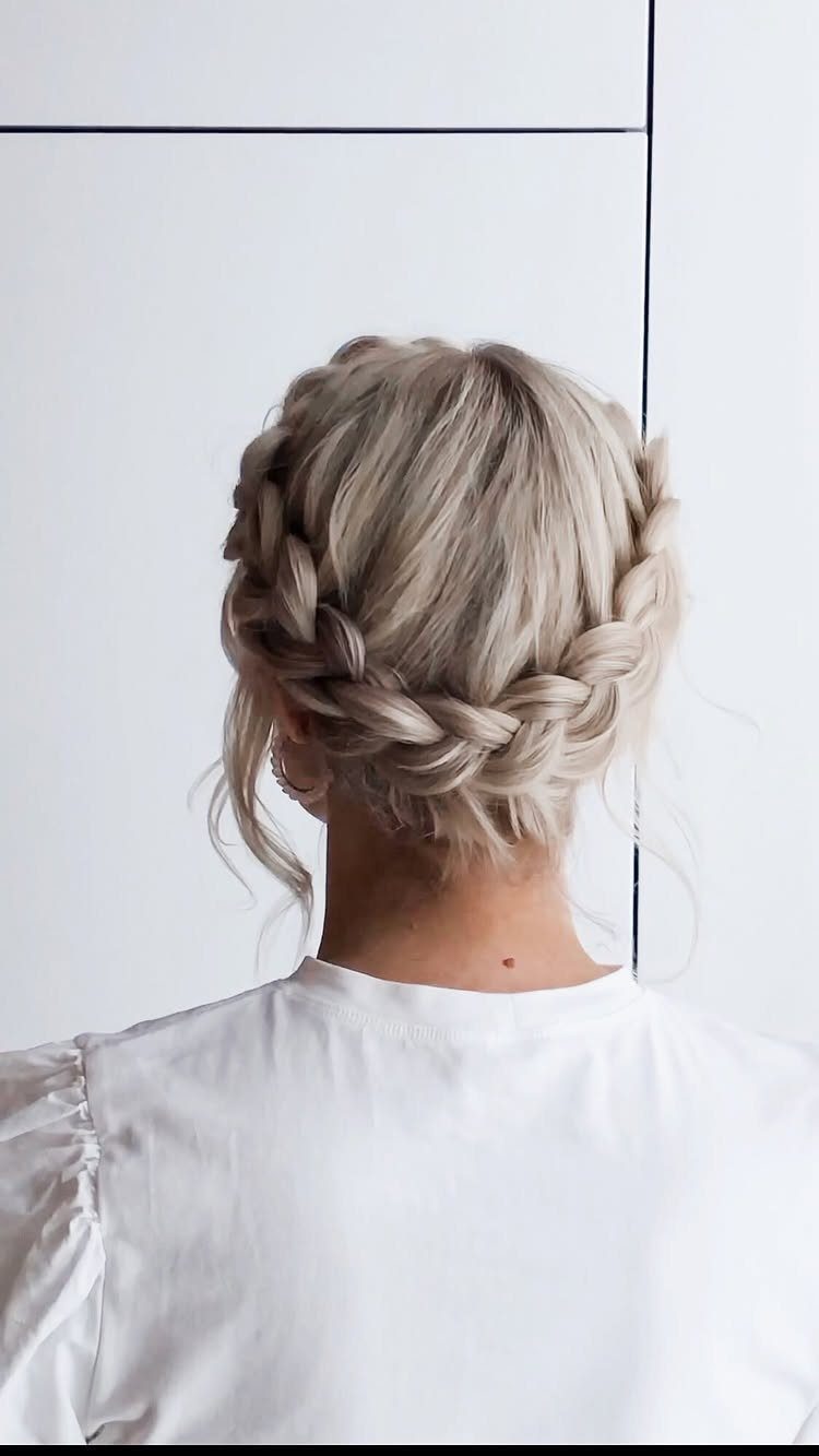 Blonde woman wearing a thick braided crown wrapped around her head