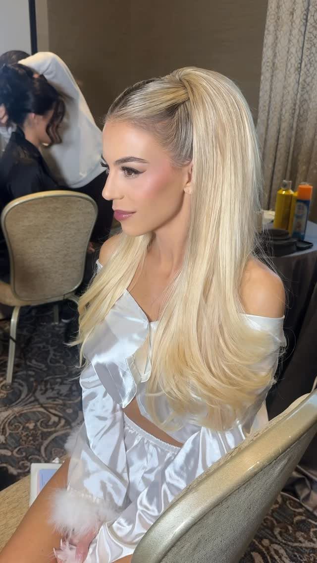 Blonde bride with long straight hair in a high half-ponytail
