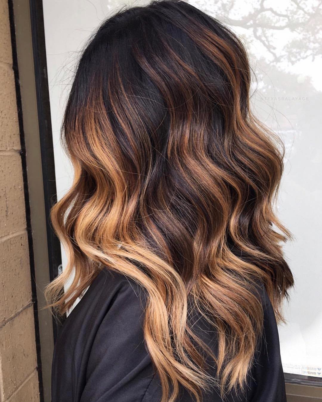 Wavy dark brown hair with seamless bronze balayage highlights