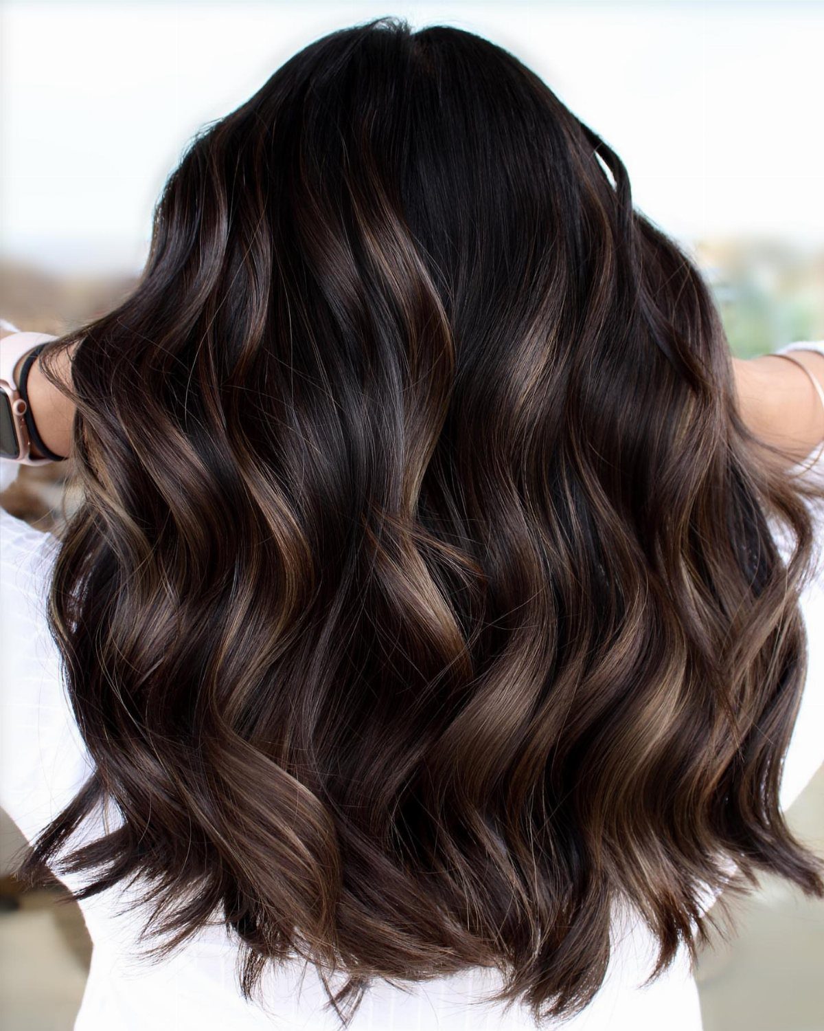 Nearly black espresso-brown waves show a soft, glossy finish