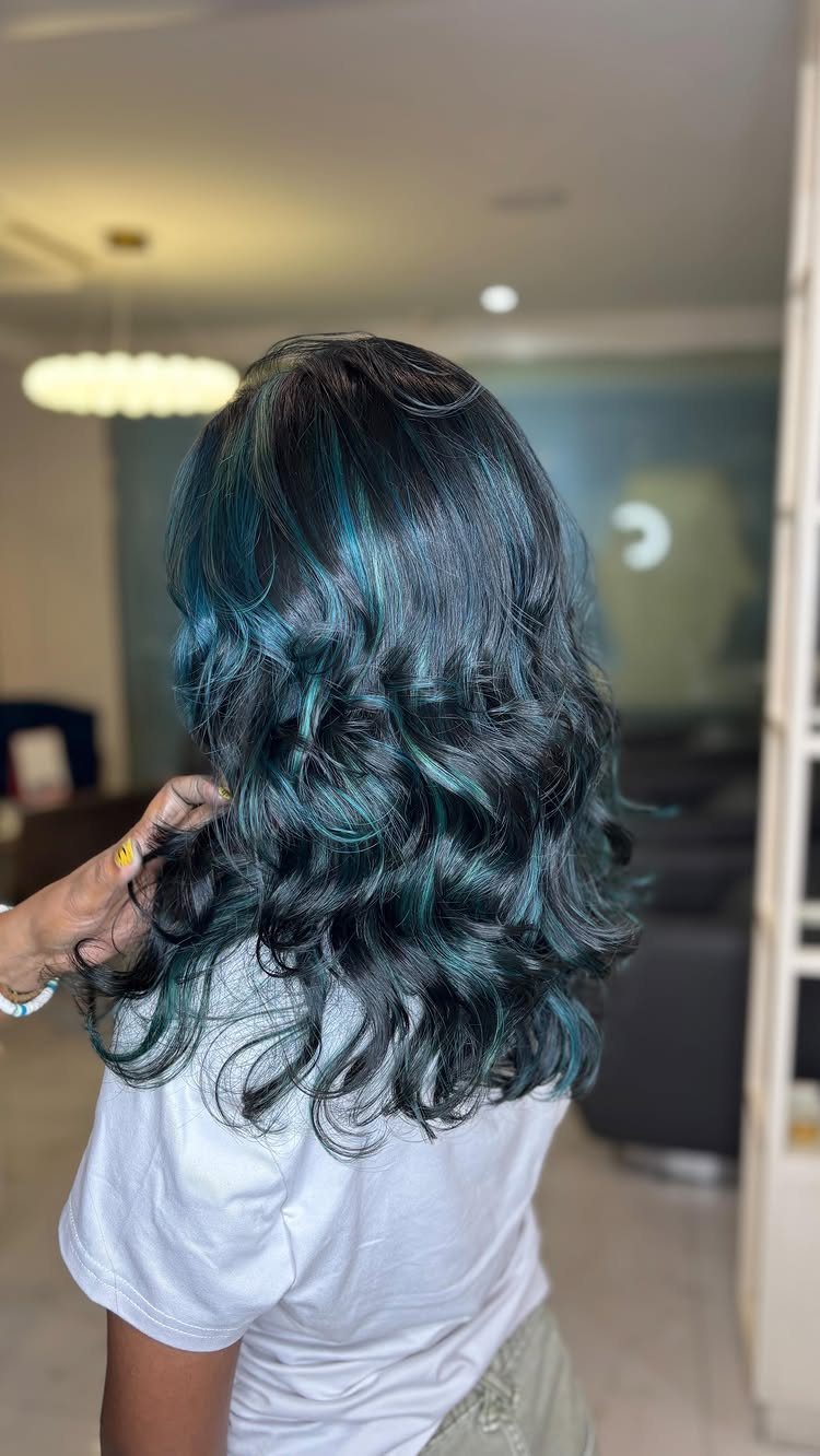 Long wavy teal-blue hair with green tones shown from behind