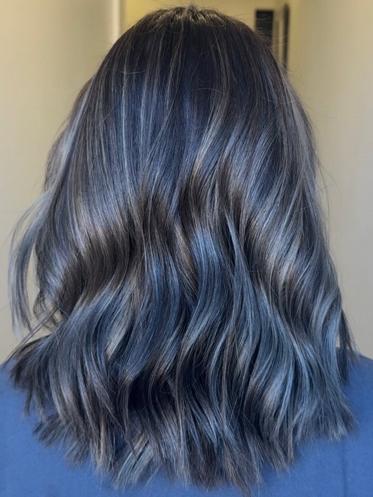 Long wavy dark brown hair with cool metallic silver-blue tones