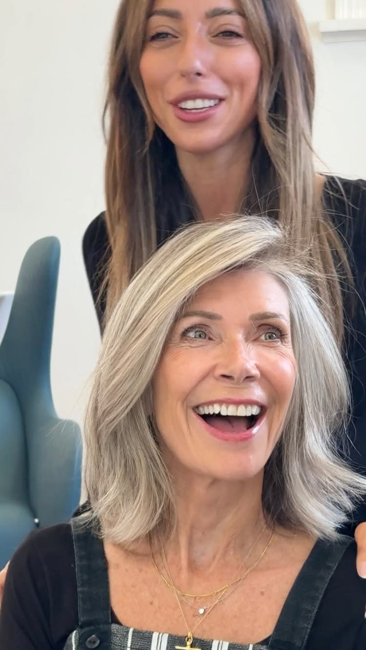 Older woman shows shoulder-length ash-blonde hair blended with silver strands