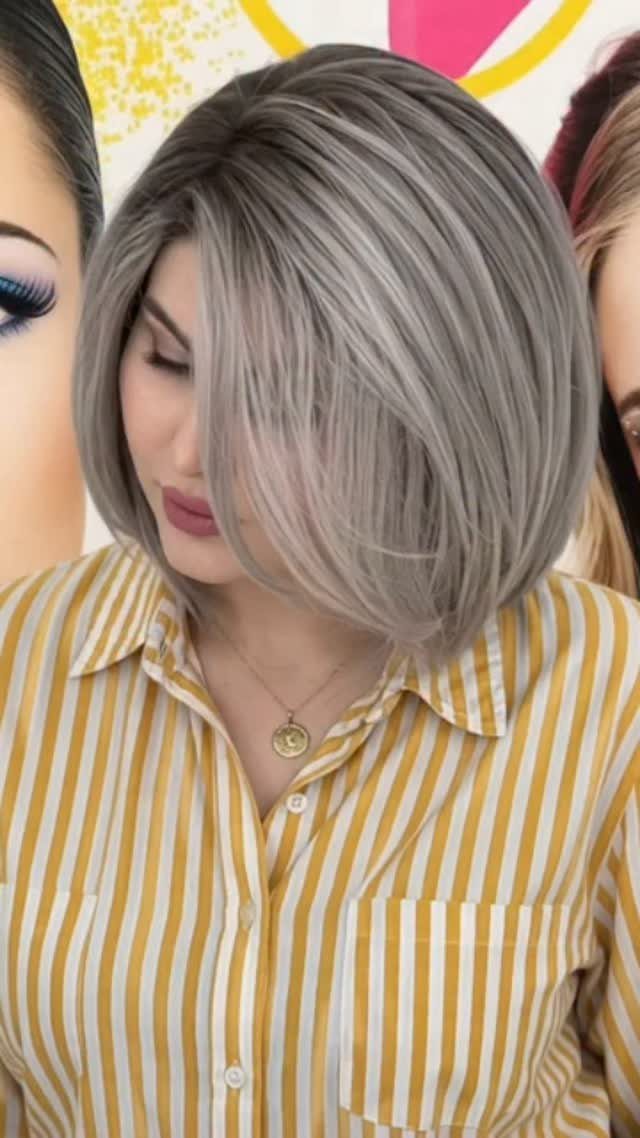Woman with a smooth silver-grey bob and deep side part
