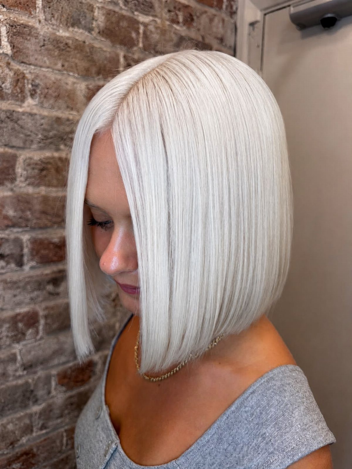 Pale icy silver-blonde bob with a smooth, straight finish