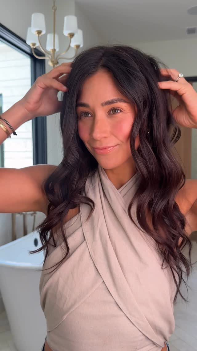 Woman with long, wavy, natural-looking dark brown hair