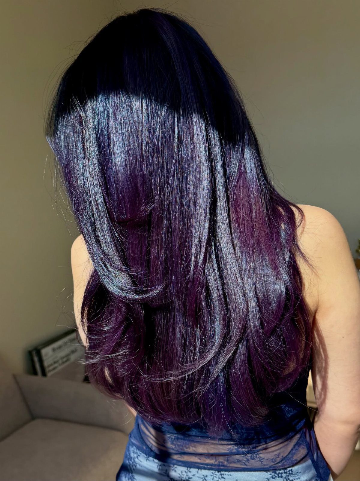 Long dark violet hair with glossy purple lengths and softly curled ends