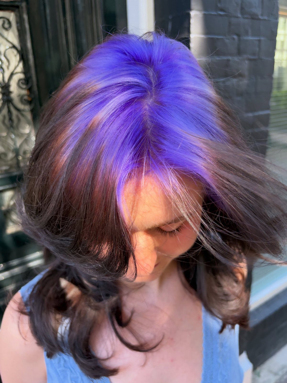 Purple and dark brown layered hair viewed from above beside a doorway