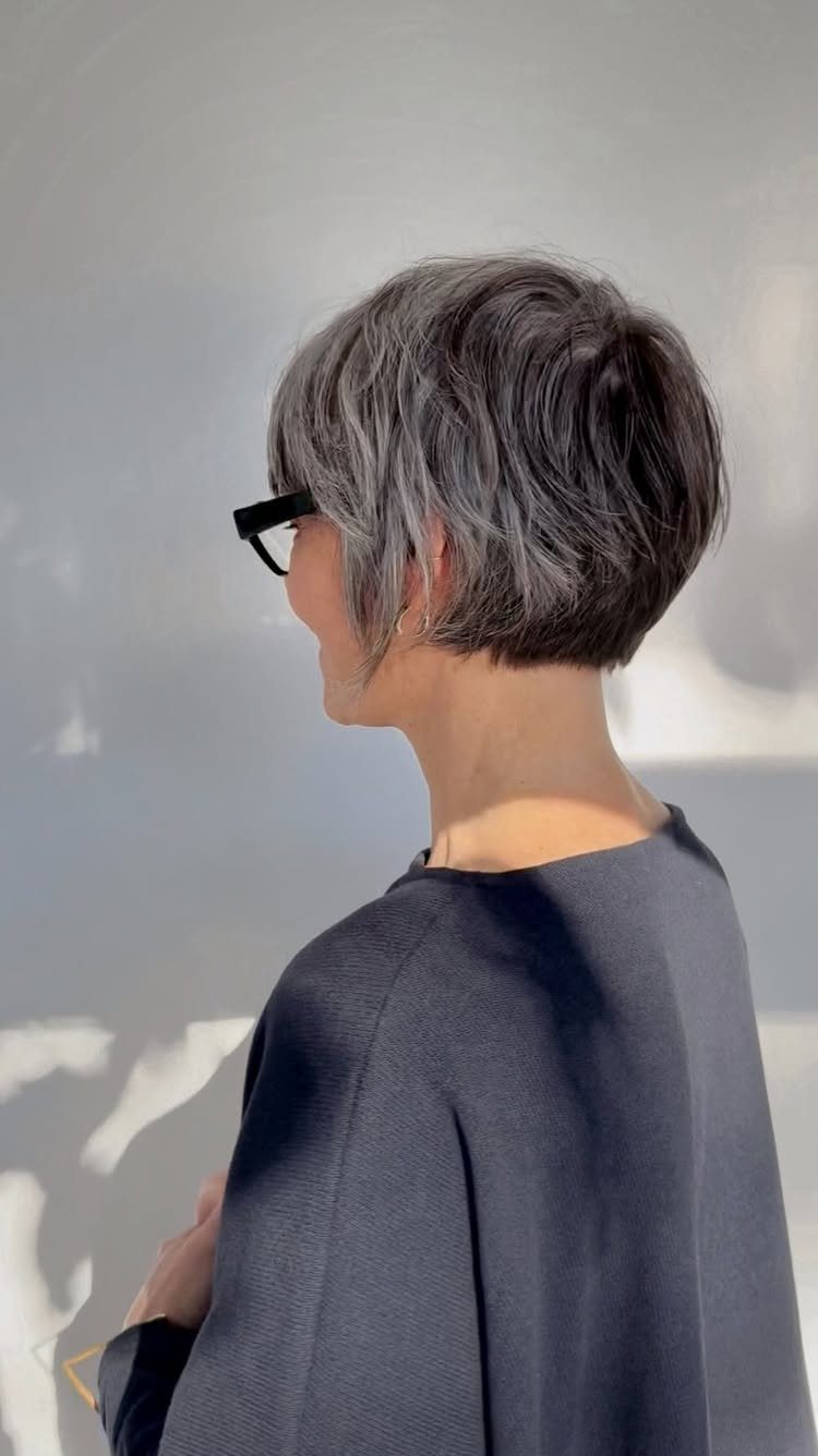 Short gray pixie bob with a fuller front and cropped back