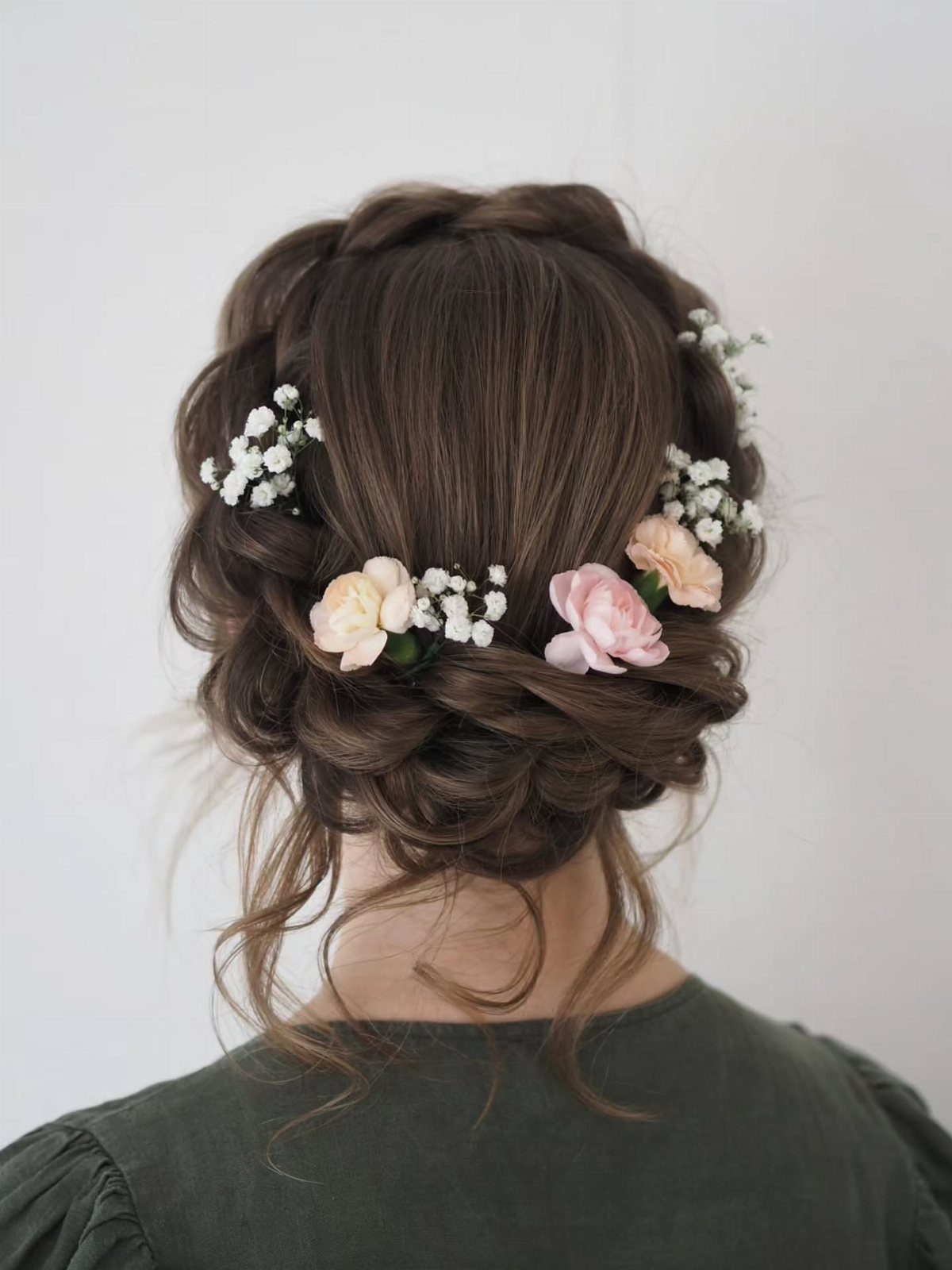 Brown braided crown hairstyle with pink roses and white flowers